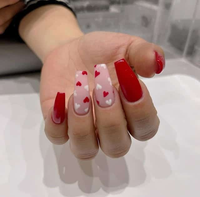 7. Red and Sheer Heart Coffin Nails - medium length coffin nail ideas