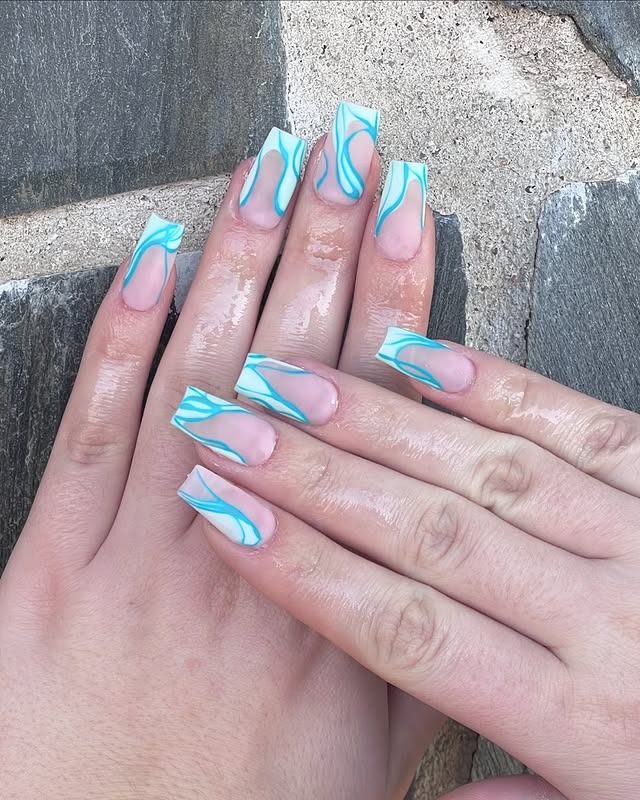 9. Aqua Swirl Nude Coffin Nails - medium length coffin nail ideas