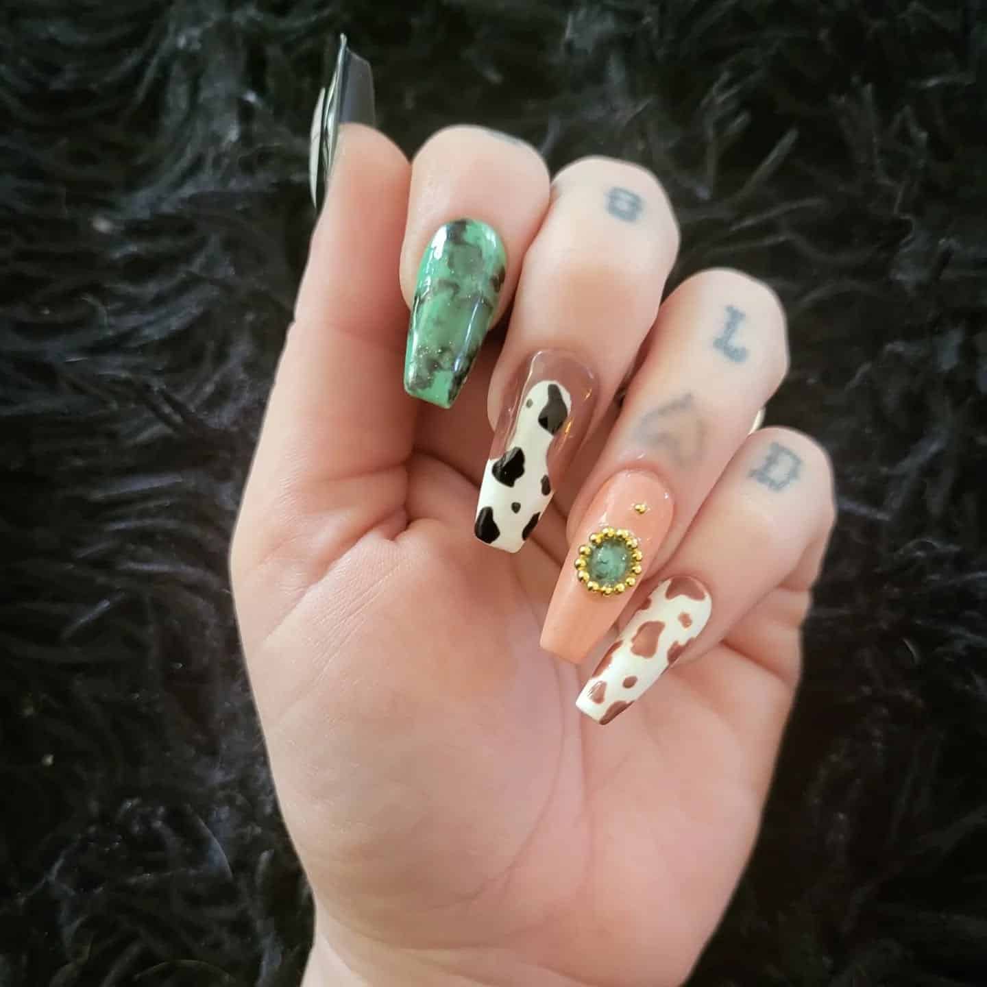 15. Western Cow Print Coffin Nails - medium length coffin nail ideas