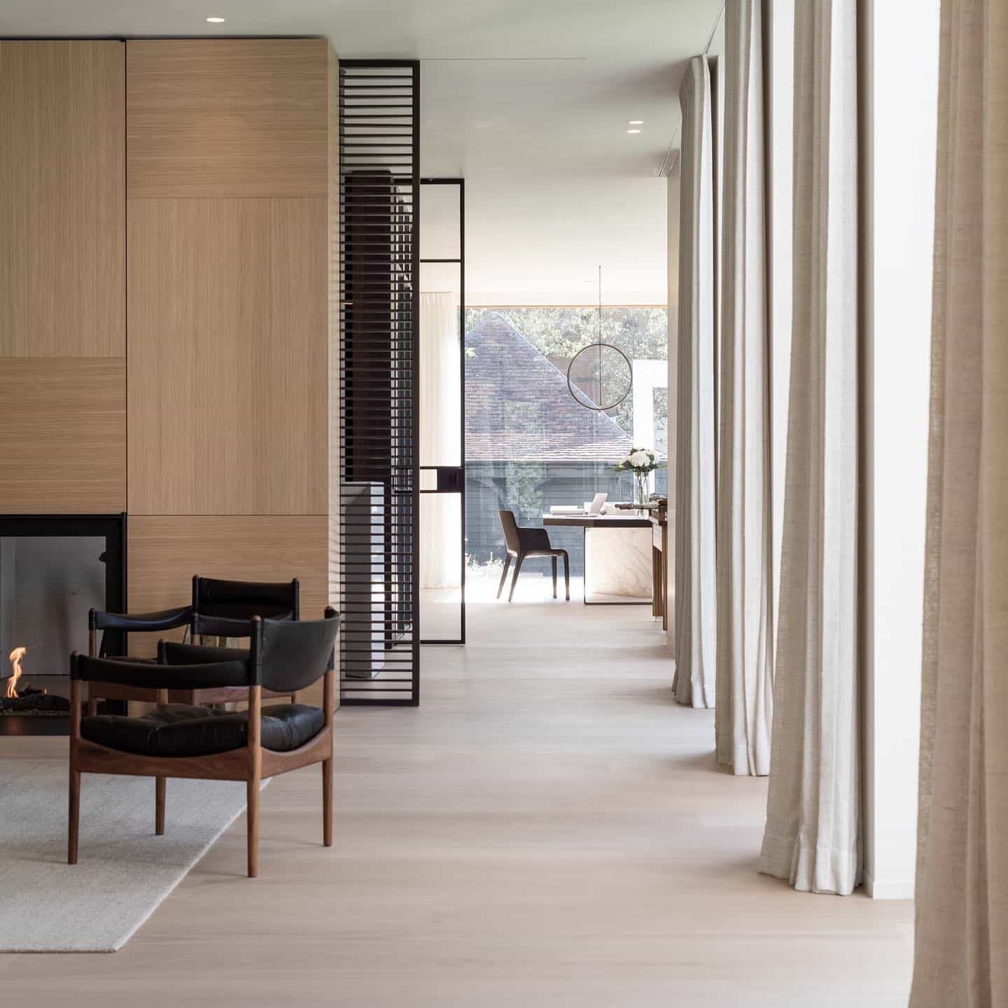 1. Warm Minimal Living Room Office in Soft Oak and Black - living room office ideas