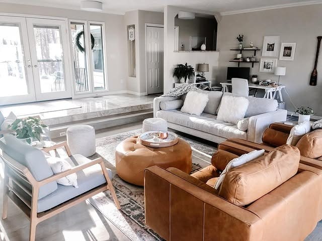 6. Open-Concept Living Room Office in Cream, Tan, and Soft Gray - living room office ideas