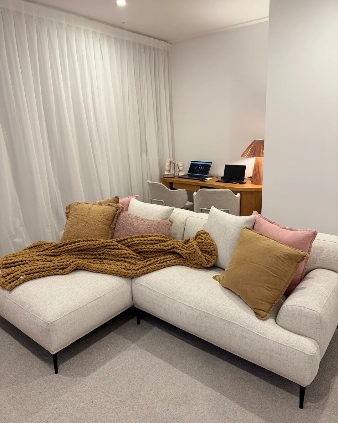 16. Family-Friendly Living Room Office in Beige and Soft Blush - living room office ideas