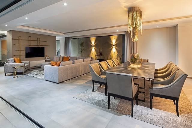 10. Open-Plan Grey and Gold Living Area with Cohesive Flow - grey and gold living room ideas