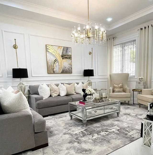 19. Elegant Grey Living Room with Statement Gold Chandelier - grey and gold living room ideas