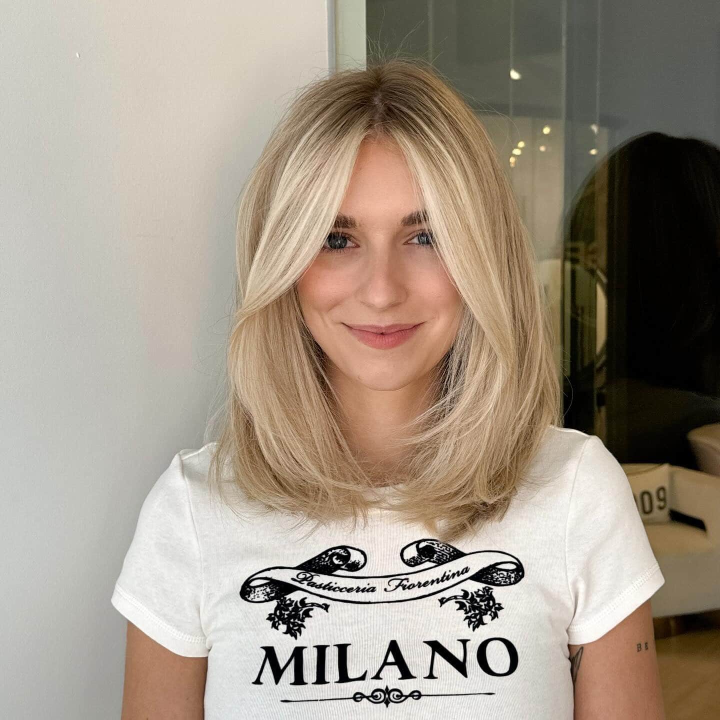 16. Layered Blonde Curtain Cut with Soft Dimension - Blonde Hair with Lowlights