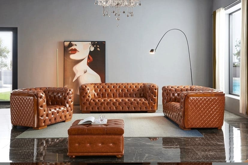 2. Classic Chesterfield Statement in an Open Living Area - brown leather sofa living room ideas