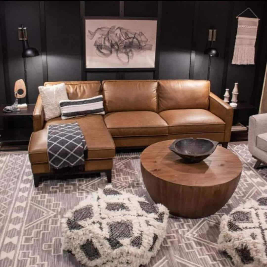 13. Moody Black Walls Paired with Classic Leather - brown leather sofa living room ideas
