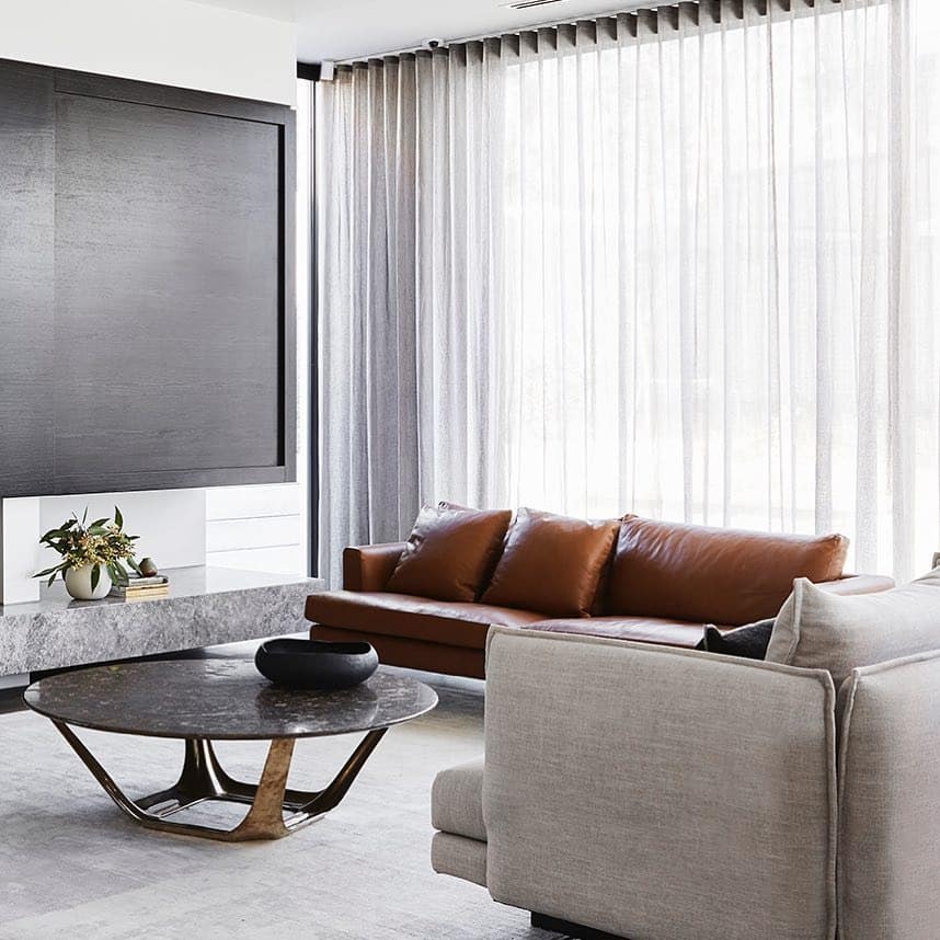 14. Contemporary Minimal Living Room with Leather and Stone - brown leather sofa living room ideas