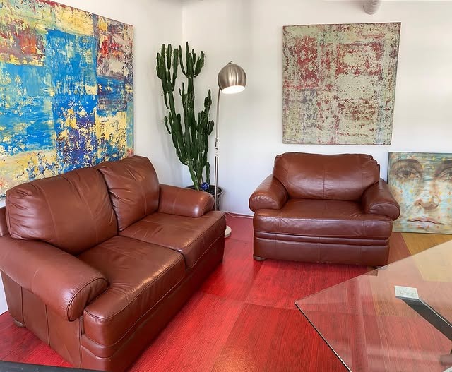 19. Bold Color Accents with Classic Leather Seating - brown leather sofa living room ideas