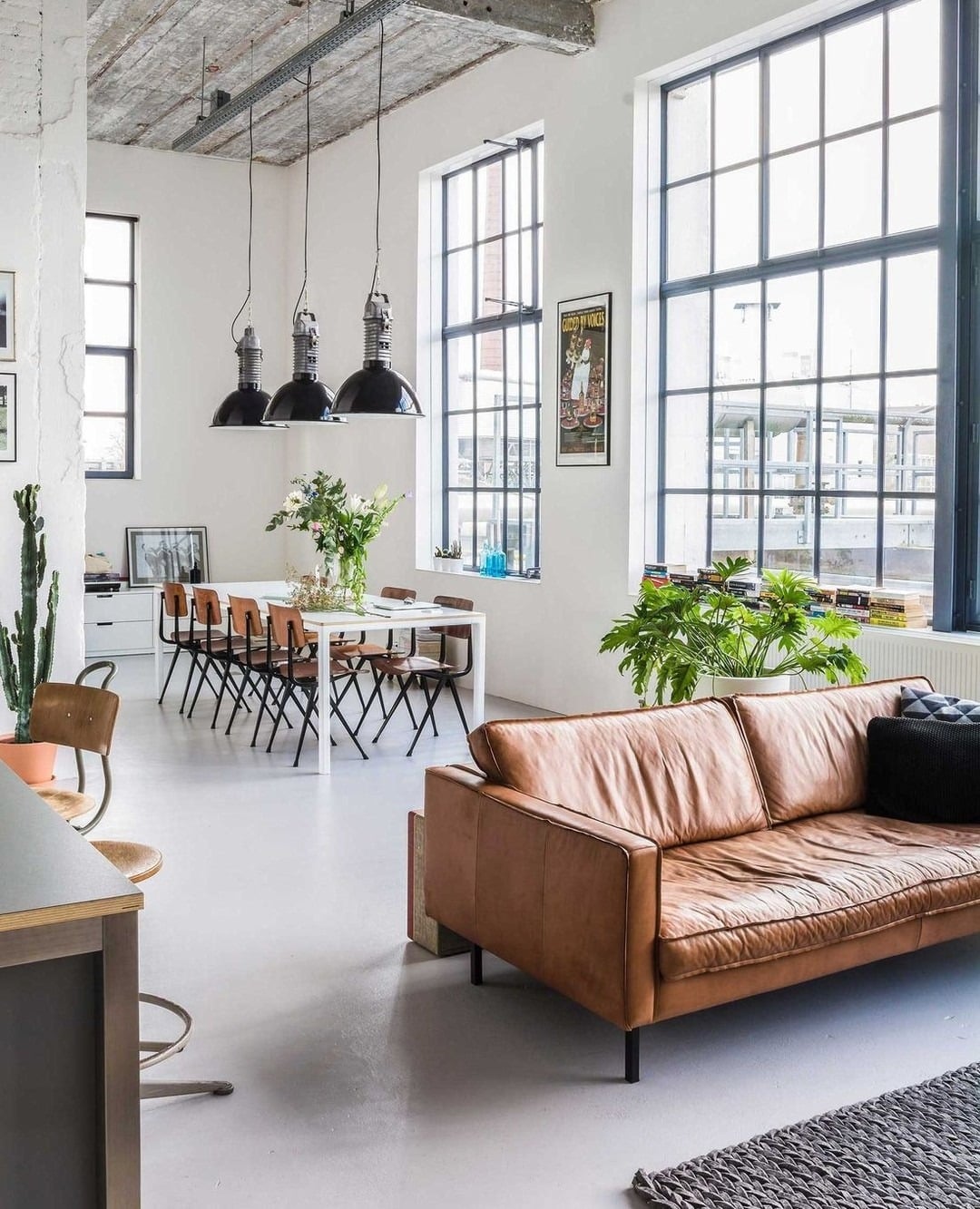 21. Industrial Loft Living Room with Warm Brown Leather - brown leather sofa living room ideas