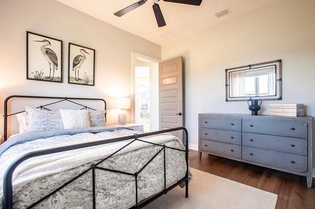 6. Minimal Black Frame with Soft Blush Accents - metal bed frame bedroom ideas