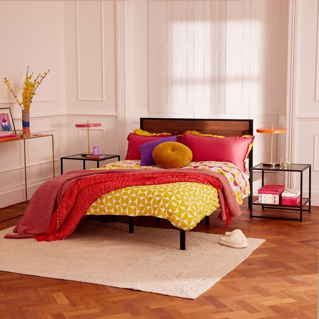 13. Playful Modern Black with Bold Color Accents - metal bed frame bedroom ideas