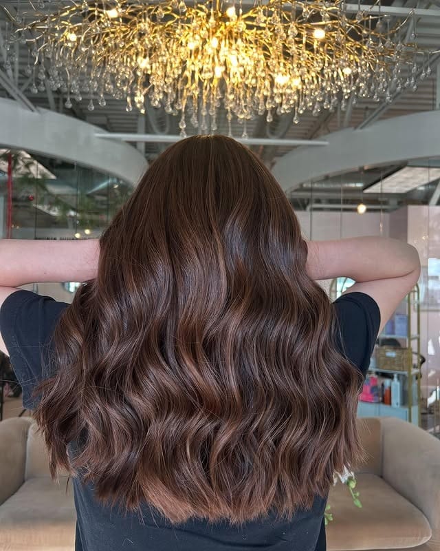 7. Chestnut Brown Waves with Soft Lived-In Lightness - Brown Hair with Highlights