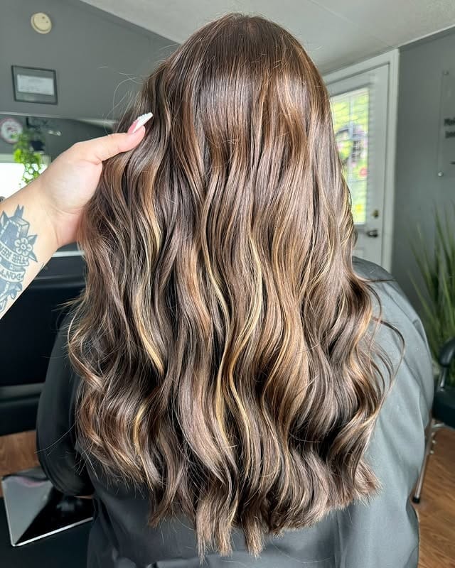 11. Cool Brunette Waves with Soft Blonde Detailing - Brown Hair with Highlights