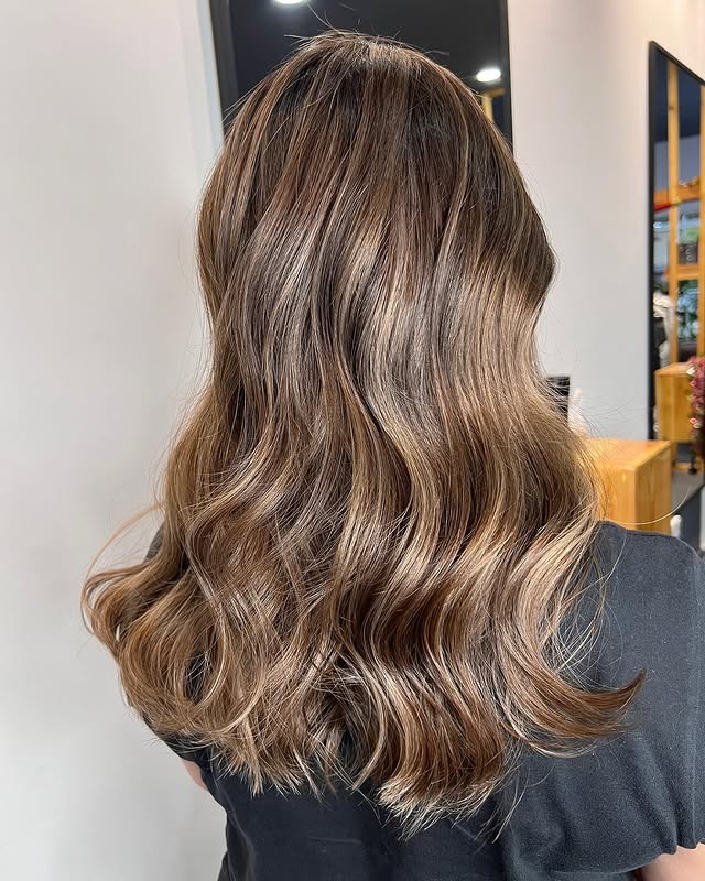 22. Light Brown Waves with Subtle Beige Highlighting - Brown Hair with Highlights