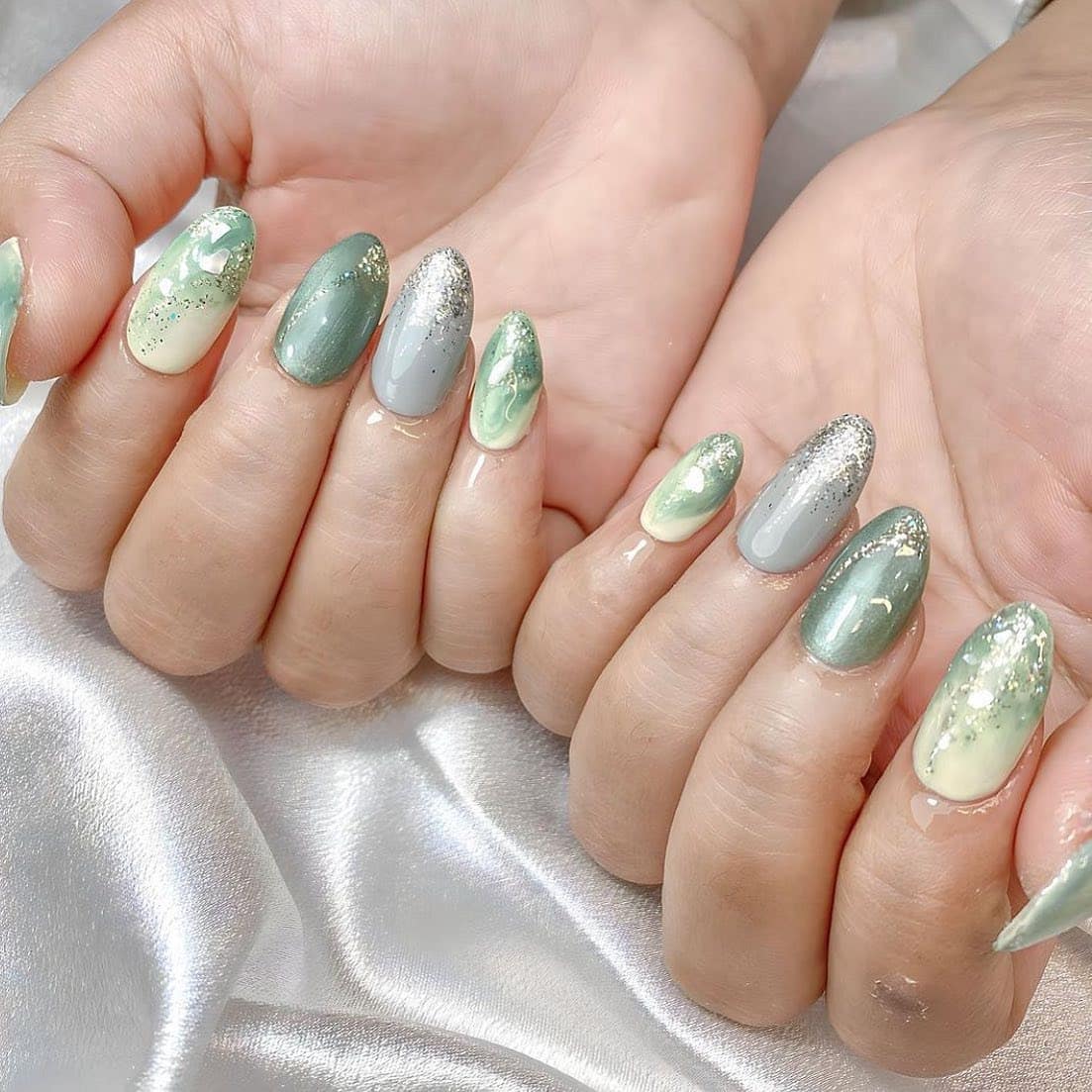 1. Mint Marble Foil Almond Nails - mint color nail ideas