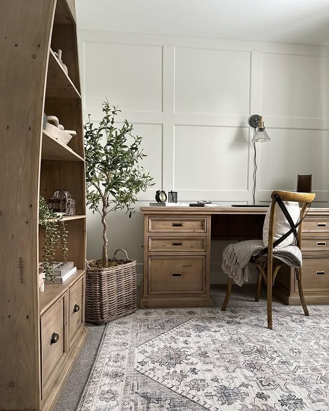 3. Refined Farmhouse Workspace with Light Oak and Crisp White Paneling - farmhouse office ideas