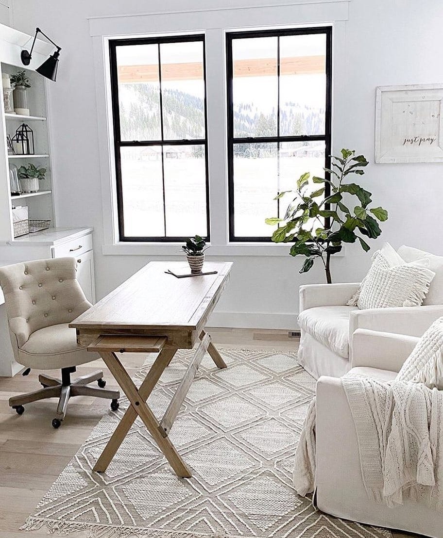 16. Family-Friendly Farmhouse Office with Wood Desk and Black Accents - farmhouse office ideas