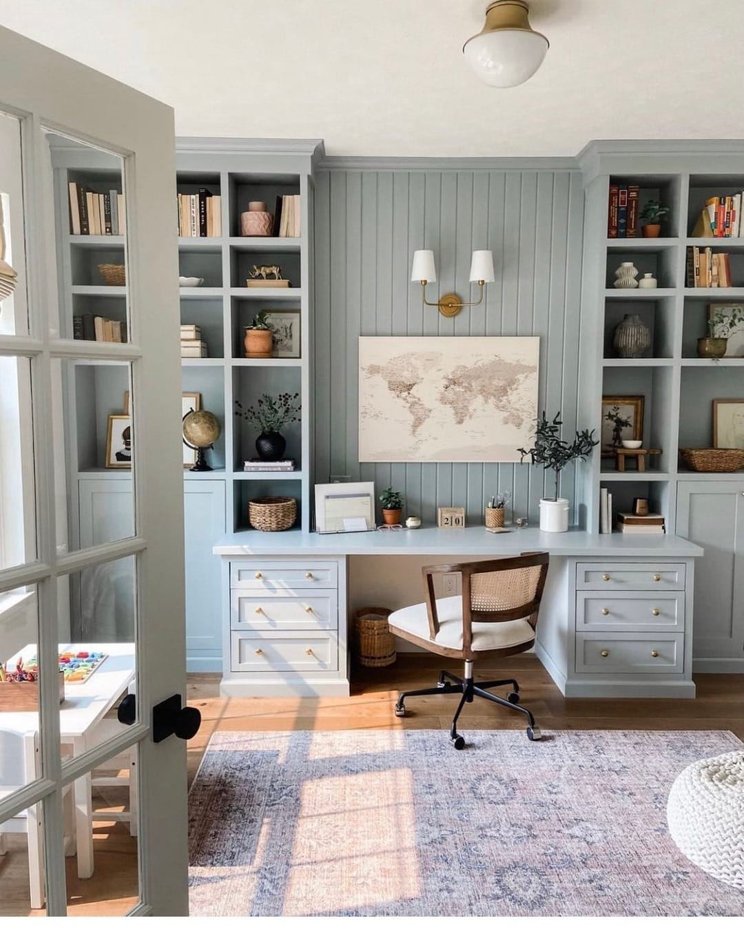 20. Tailored Farmhouse Office with Soft Blue Built-Ins and Warm Brass - farmhouse office ideas