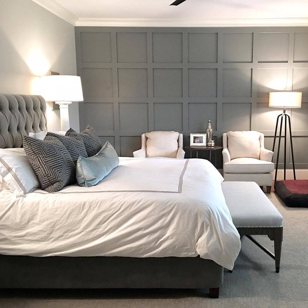 2. Tailored Elegance with Paneled Gray Walls - gray wall bedroom ideas