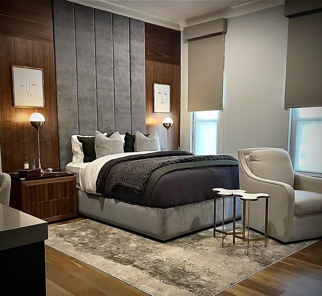12. Modern Hotel Gray with Wood Panel Accents - gray wall bedroom ideas