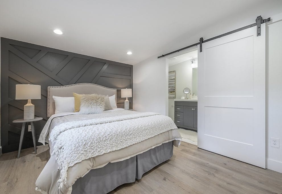 17. Graphic Gray Feature Wall with Clean Lines - gray wall bedroom ideas