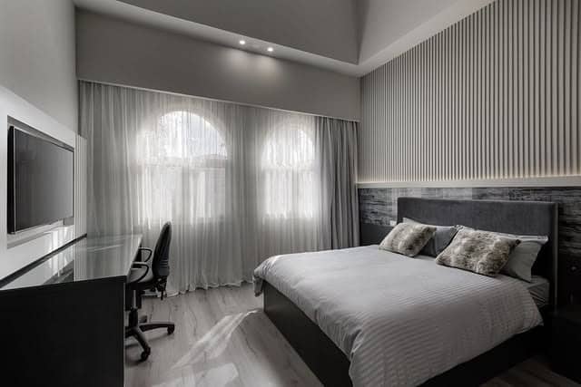 20. Modern Gray with Vertical Detailing - gray wall bedroom ideas