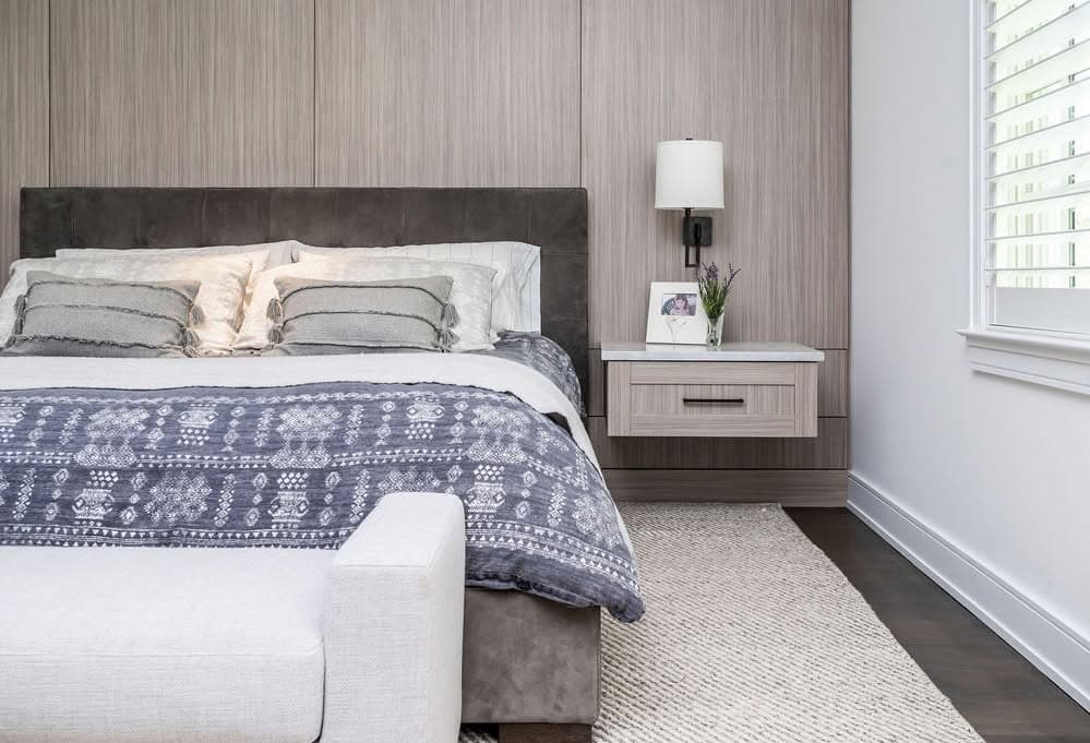 21. Warm Modern Gray with Integrated Wood Storage - gray wall bedroom ideas