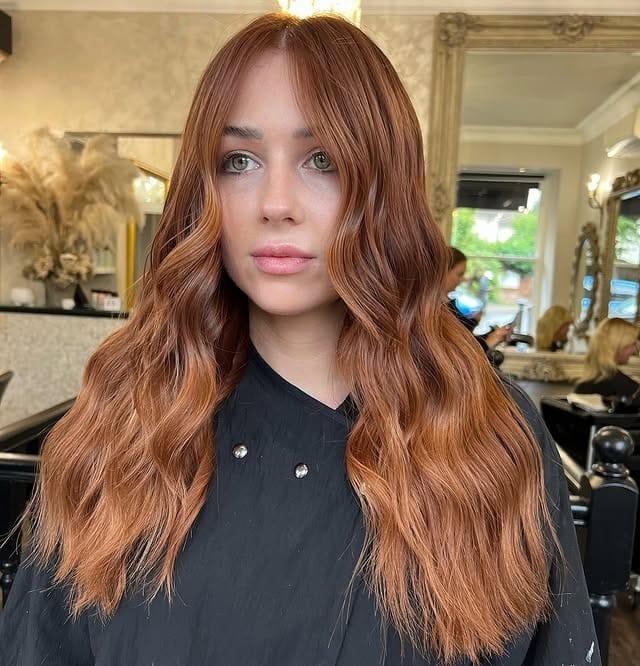3. Polished Long Layers with Warm Auburn Gloss - Auburn Hair Color