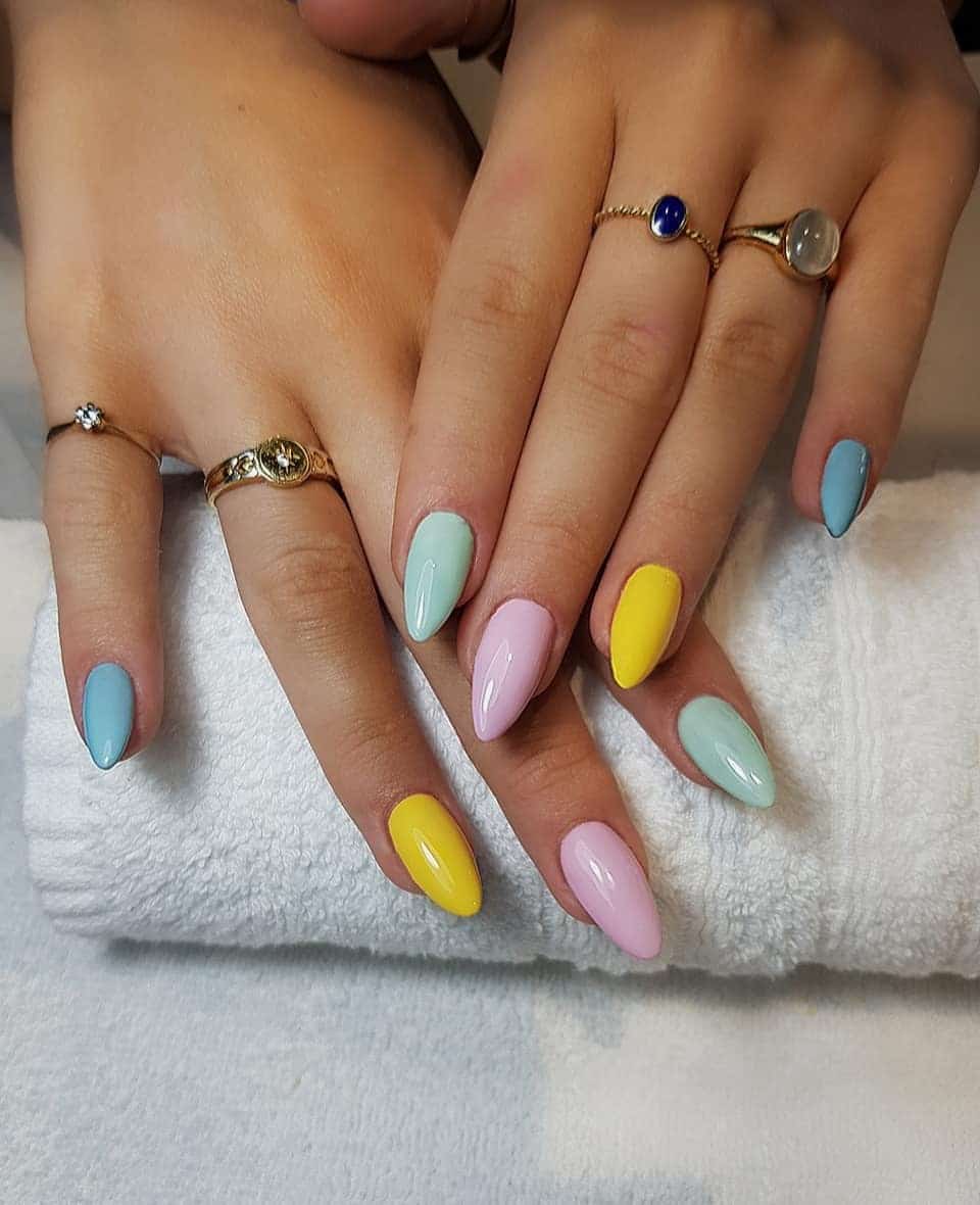7. Pastel Solid Almond Nails in Blue, Pink, and Yellow - multicolored nail ideas