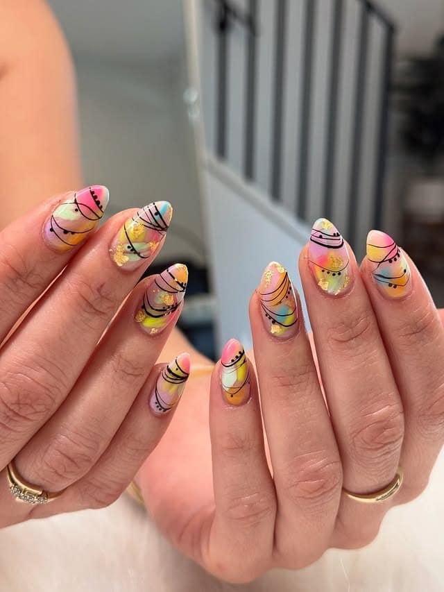 9. Gold Foil Abstract Nails in Peach, Mint, and Black Line Art - multicolored nail ideas