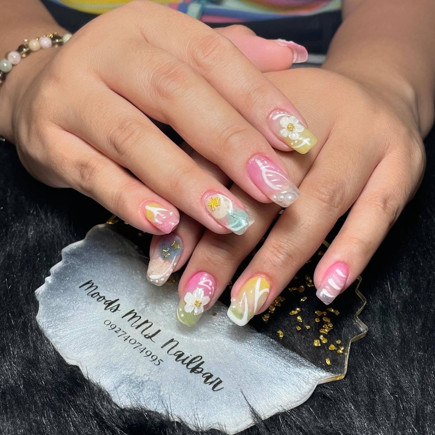 19. Mixed Media Almond Nails with Floral and Pearl Details - multicolored nail ideas