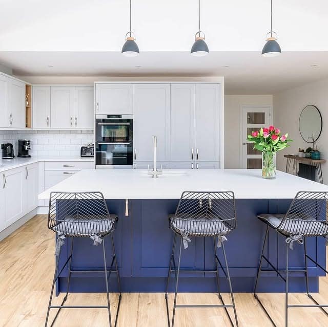 3. Two-Tone Blue and White Kitchen with Oversized Island - gray and blue kitchen ideas