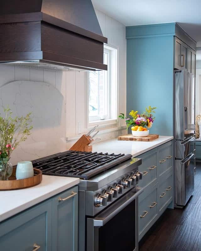 6. Soft Blue Kitchen with Warm Wood Accents - gray and blue kitchen ideas