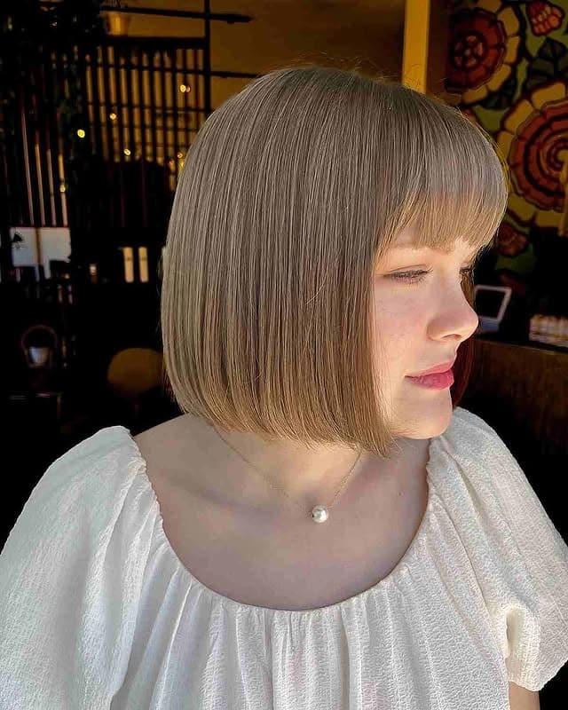 1. Precision Blunt Bob with Soft Fringe in Cool Ash Blonde - Short Hairstyles with Bangs