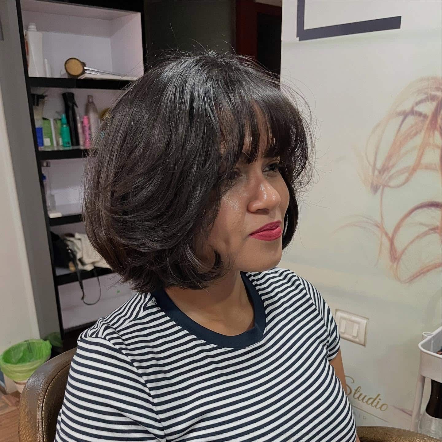 7. Rounded Layered Bob with Feathered Bangs in Rich Chocolate Brown - Short Hairstyles with Bangs