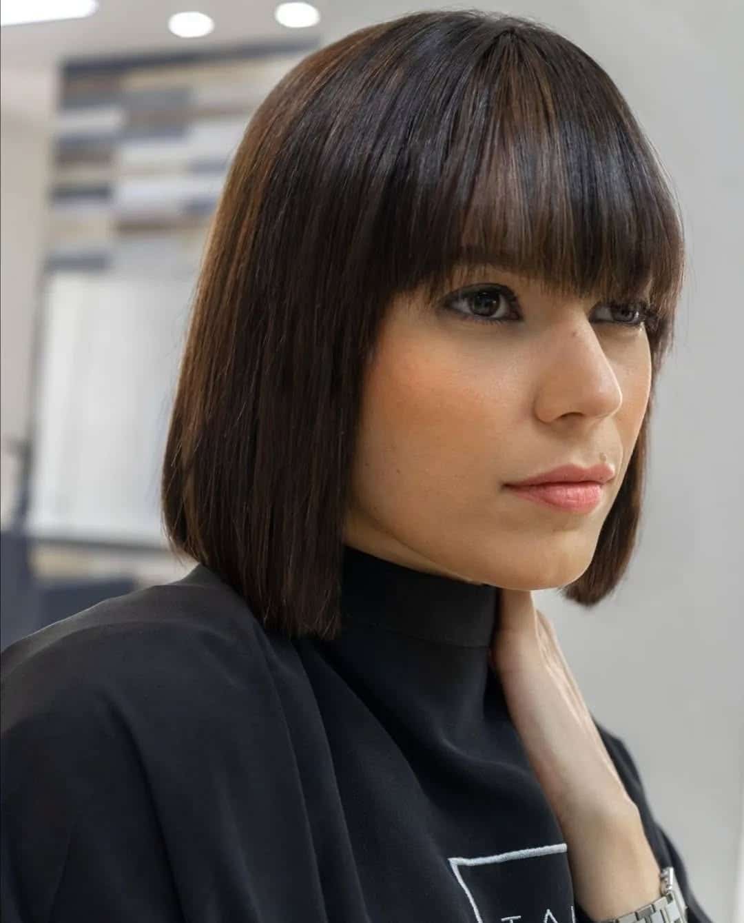 8. Sharp Modern Bob with Brow-Length Bangs in Glossy Dark Brown - Short Hairstyles with Bangs