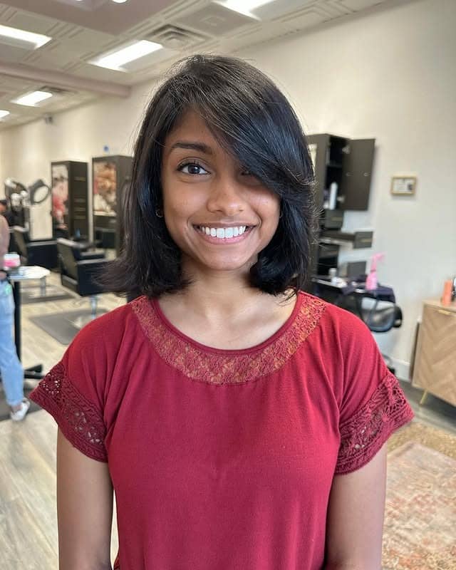 9. Soft Shoulder-Grazing Bob with Side Bangs in Natural Black - Short Hairstyles with Bangs