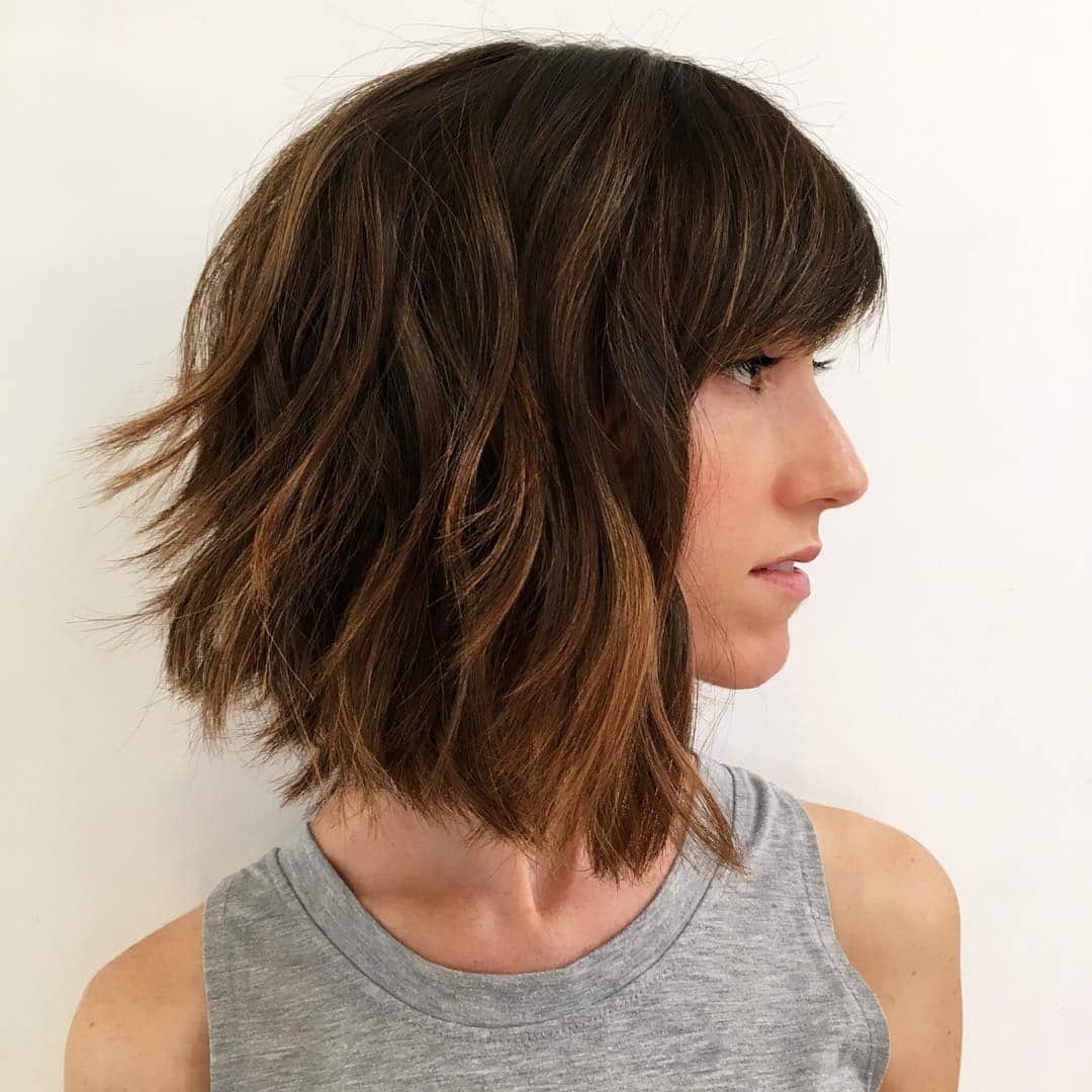 18. Wavy Chin-Length Bob with Textured Bangs in Medium Auburn Brown - Short Hairstyles with Bangs