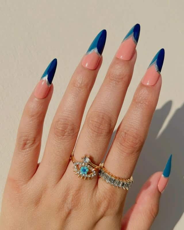 8. Diagonal Blue French Tips in Peach and Navy Tones - nautical nail ideas