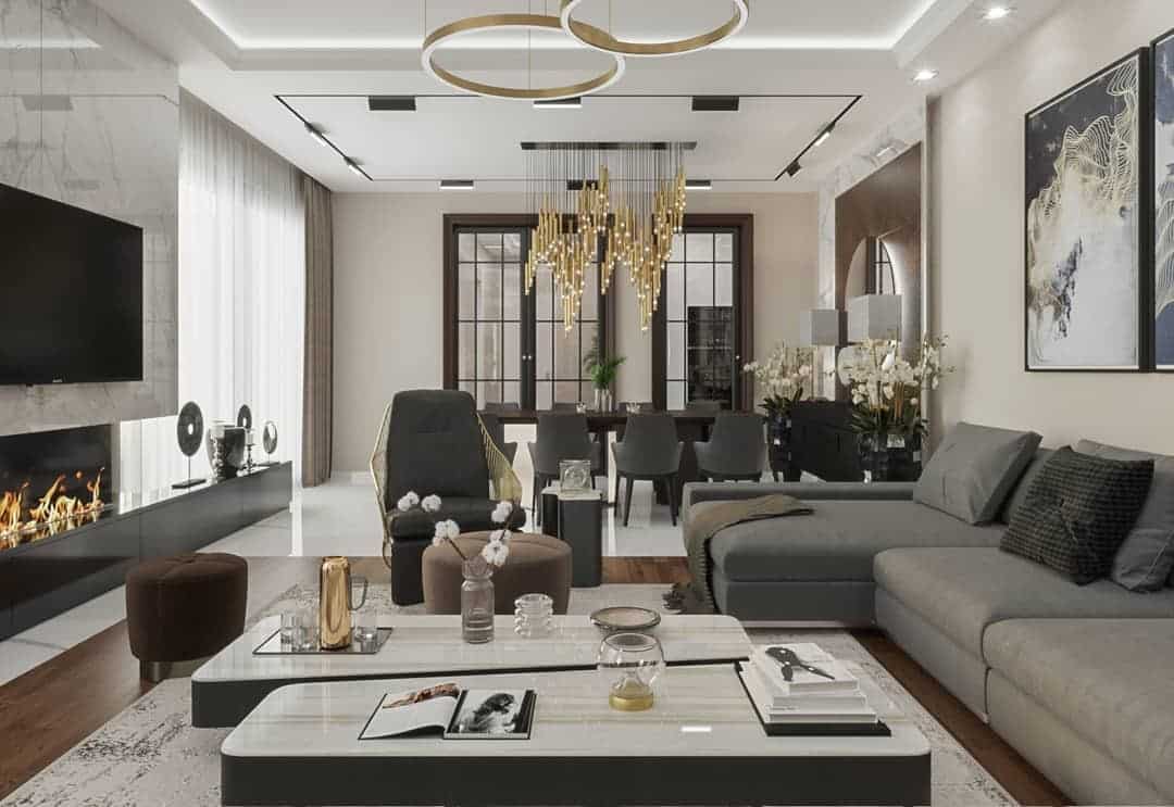 3. Luxury Open-Concept Living Room in Warm Gray and Gold - gold living room ideas