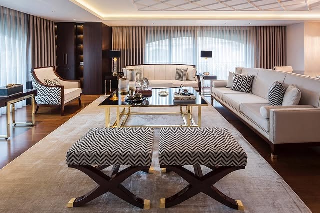 6. Classic Neutral Living Room with Structured Gold Furniture - gold living room ideas