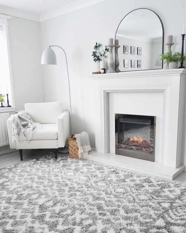 2. Soft Neutral Fireplace Mirror for a Light Living Room - living room mirror ideas