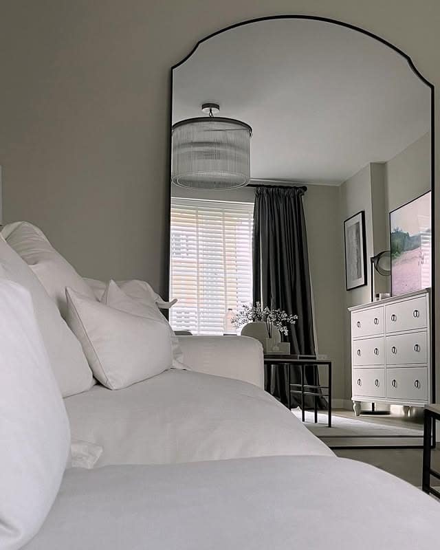 7. Arched Full-Length Mirror for a Neutral Living Space - living room mirror ideas