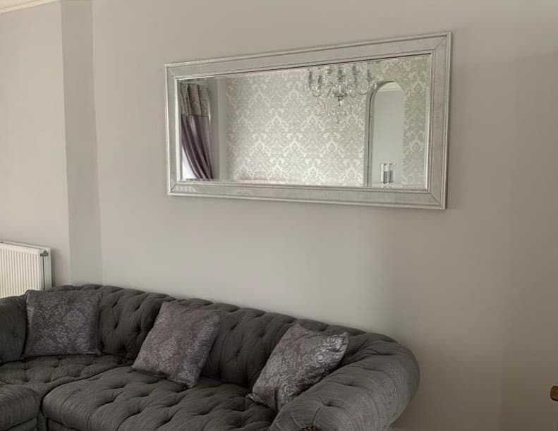 15. Horizontal Wall Mirror for a Soft Grey Living Room - living room mirror ideas