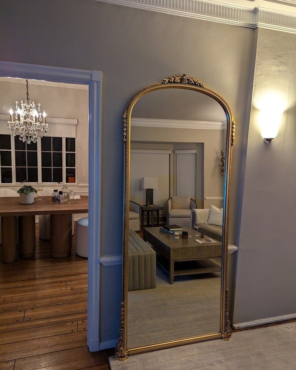16. Tall Arched Mirror with Classic Gold Frame - living room mirror ideas