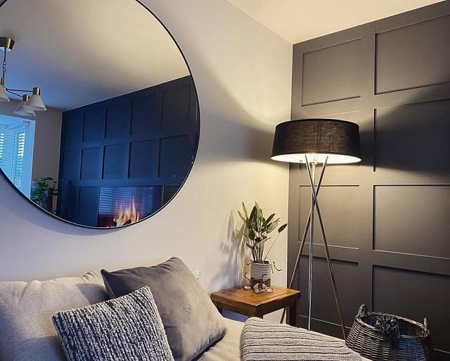 18. Large Round Mirror with Moody Grey Panelled Wall - living room mirror ideas