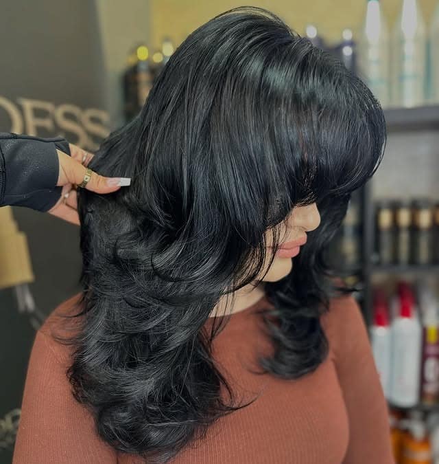 7. Layered Jet Black Blowout - Dark Hair Color