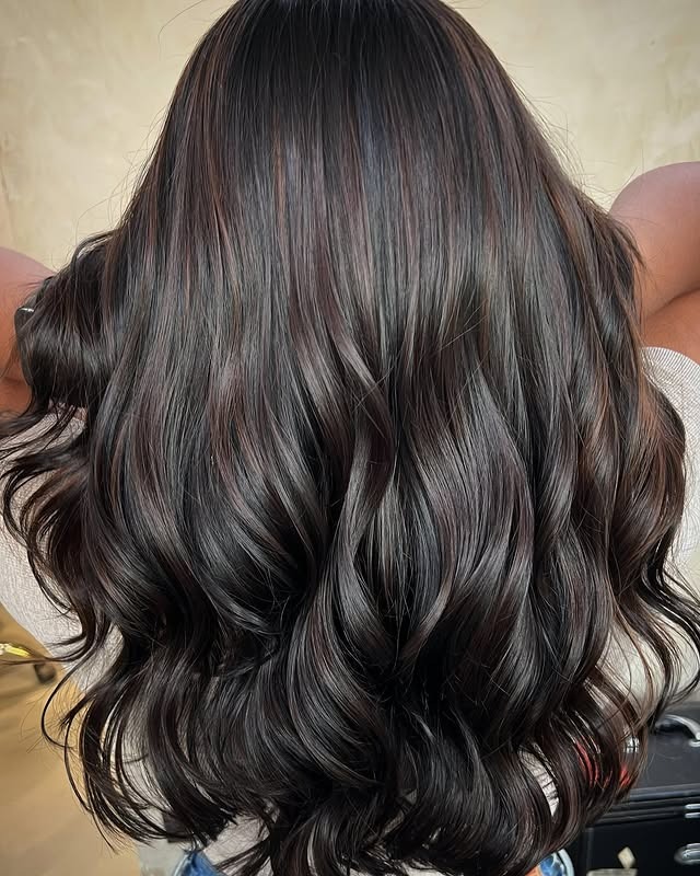 22. Glossy Dark Brunette Sculpted Waves - Dark Hair Color