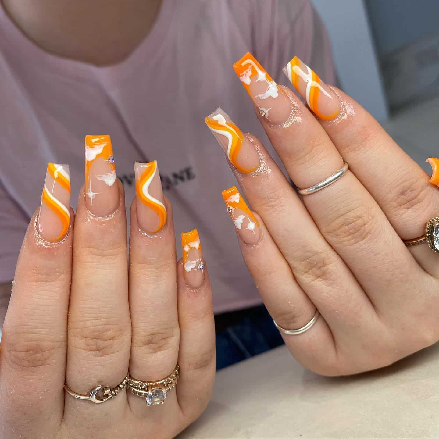 6. Sculpted Orange Swirl Nails with Clear Details - orange and white nail ideas